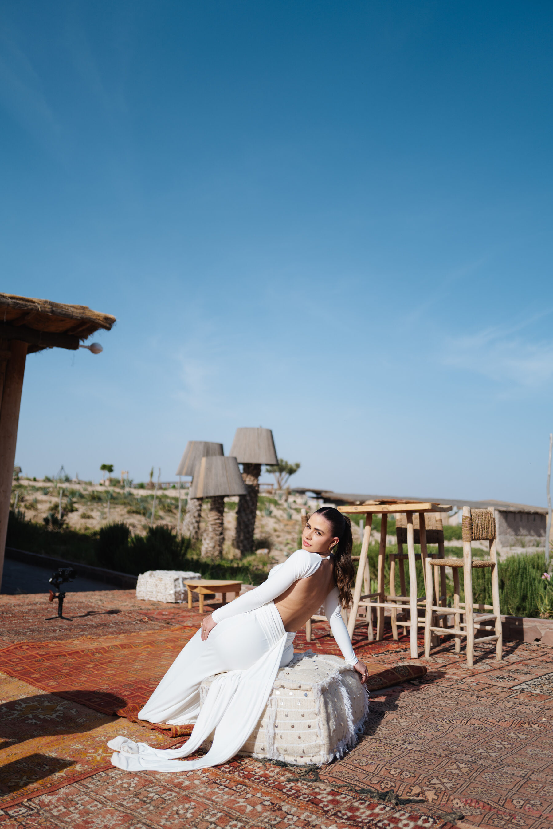 Bride in white at golden hour in a desert camp near Marrakech